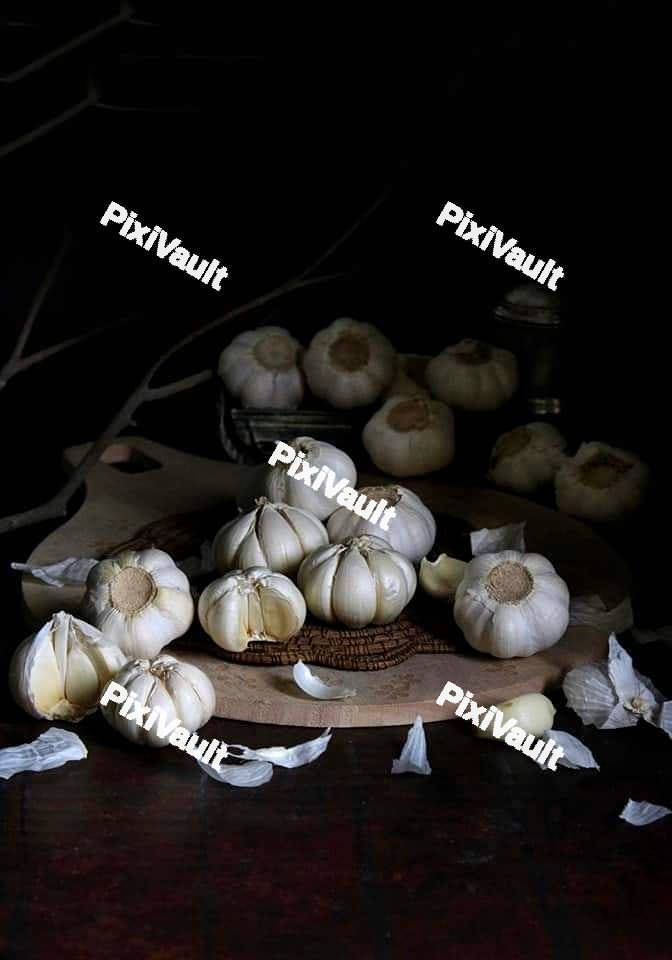Garlic bulbs on a board